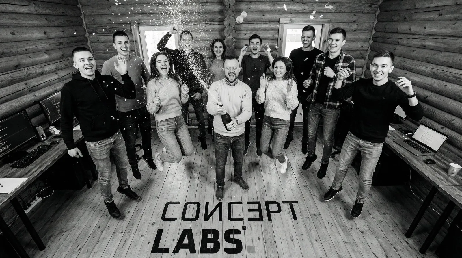 The ConceptLABS team celebrating together in their workspace